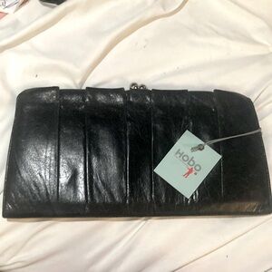 Hobo clutch , back has a pocket for your phone